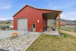 View of outbuilding with a mountain view and a view of rural / pastoral area