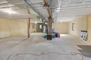 Basement featuring tankless water heater