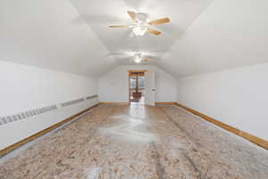 Bonus room featuring ceiling fan and baseboards