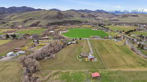 Aerial view of property and surrounding area with rural landscape and mountains