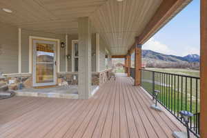 Wooden terrace featuring a mountain view