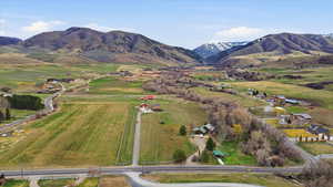 Overview of rural landscape featuring a mountainous background