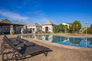 Community pool with a patio area