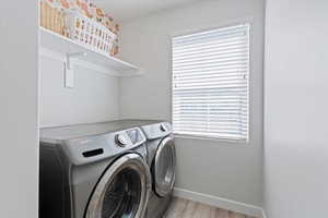 Laundry room with a window providing natural light and additional functional space.