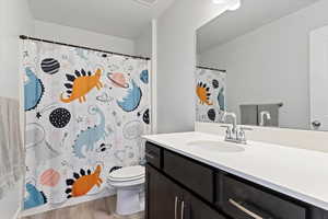 Additional bathroom featuring a quartz surround and clean, functional design.