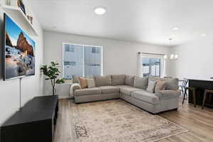 Bright living area with extra windows that bring in abundant natural light and enhance the open feel.