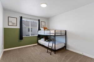 Secondary bedroom with convenient access to the additional bathroom featuring a quartz surround.