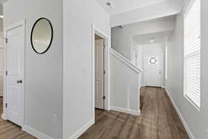 Main level with 9 foot ceilings and LVP flooring throughout creates a bright, open feel.