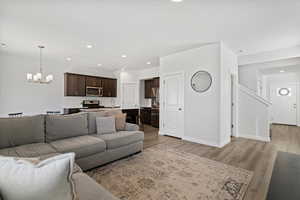 Spacious open layout with a seamless flow between living, dining, and kitchen areas, enhanced by abundant natural light.