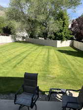 Fenced backyard featuring a patio area