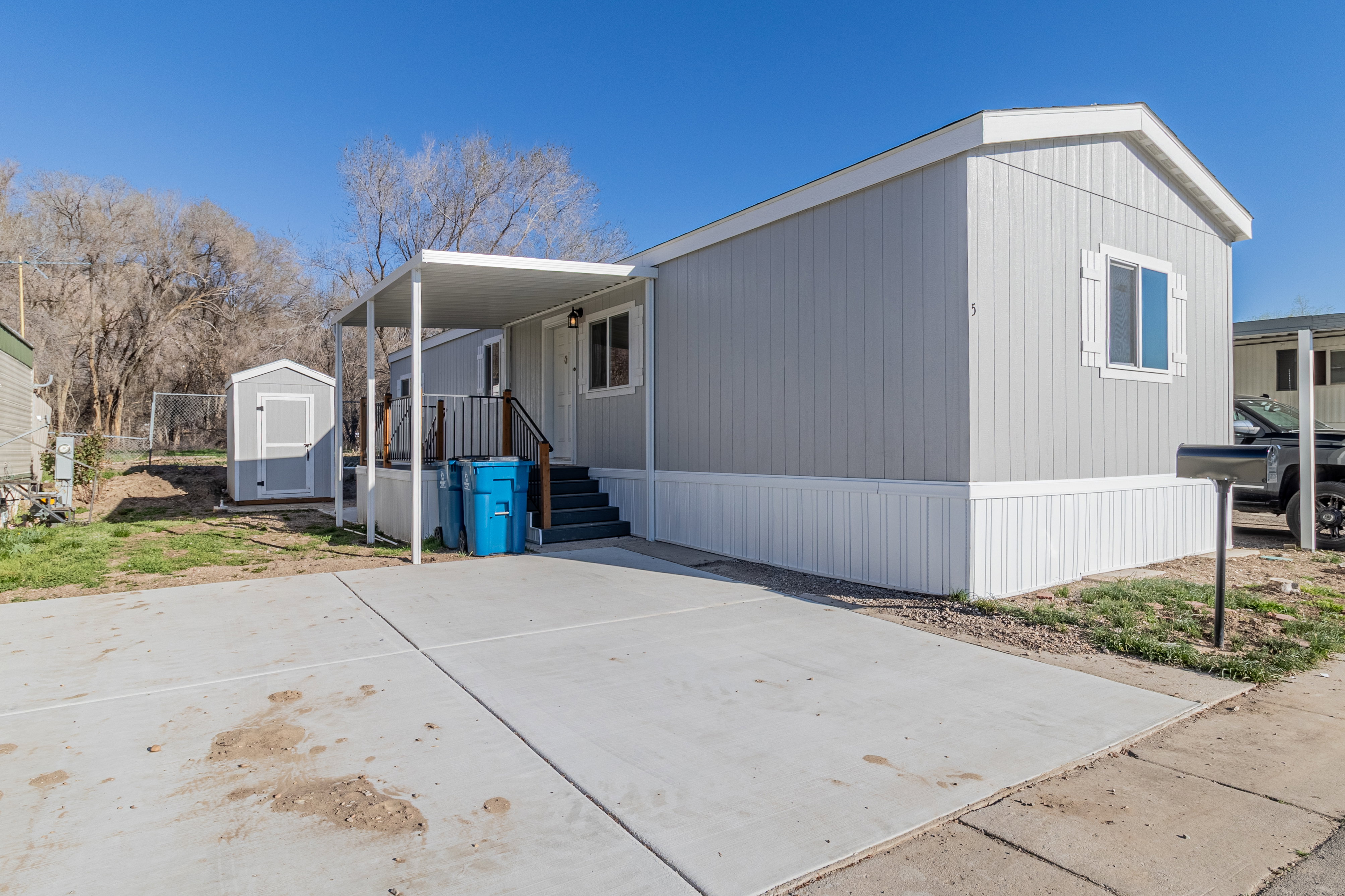 View of home's exterior featuring a shed
