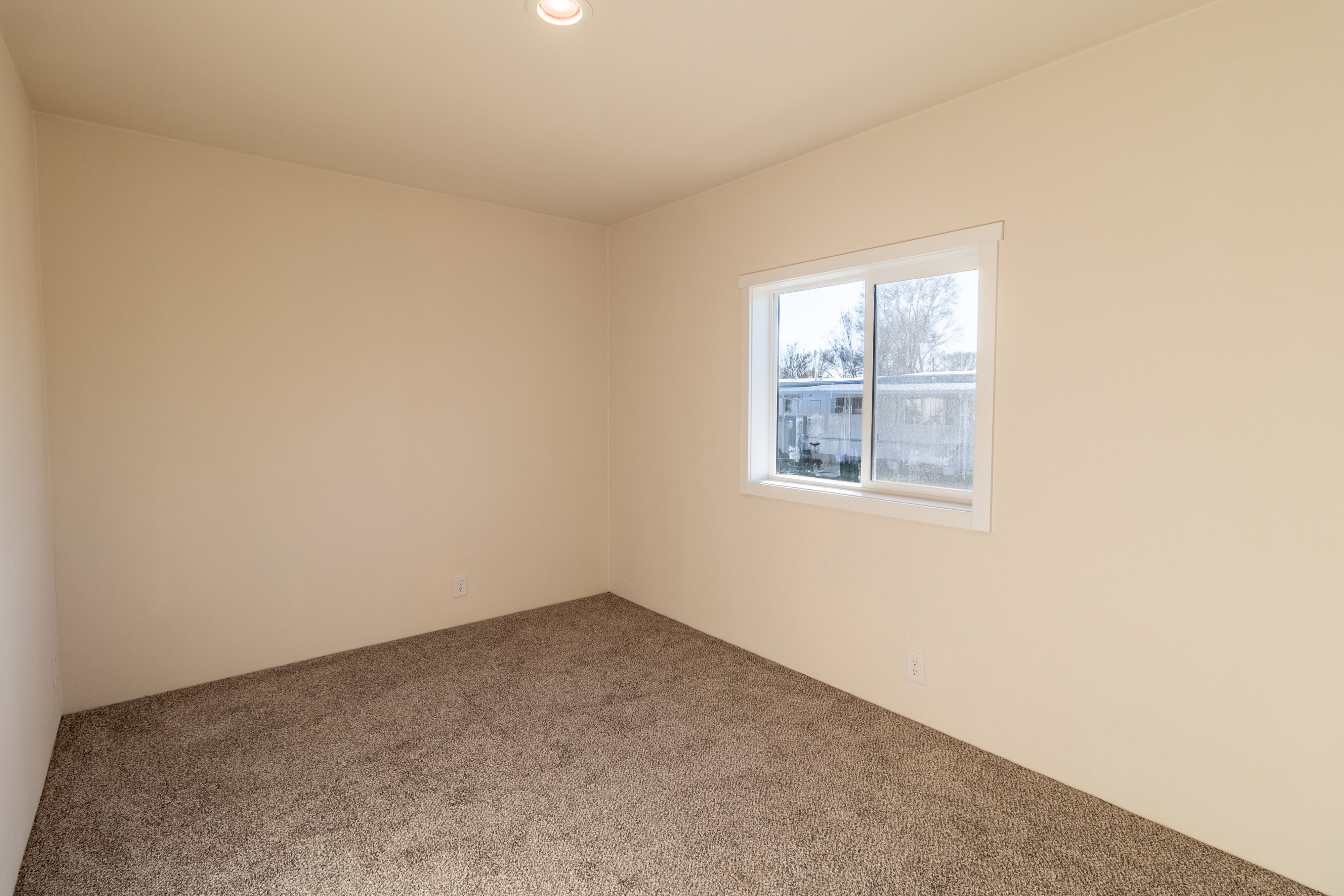 Empty room featuring carpet