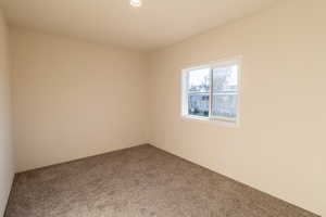 Empty room featuring carpet