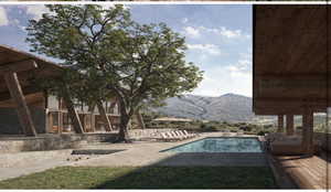Swimming pool featuring a patio and a mountain view