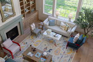 Living room with wood finished floors and a fireplace