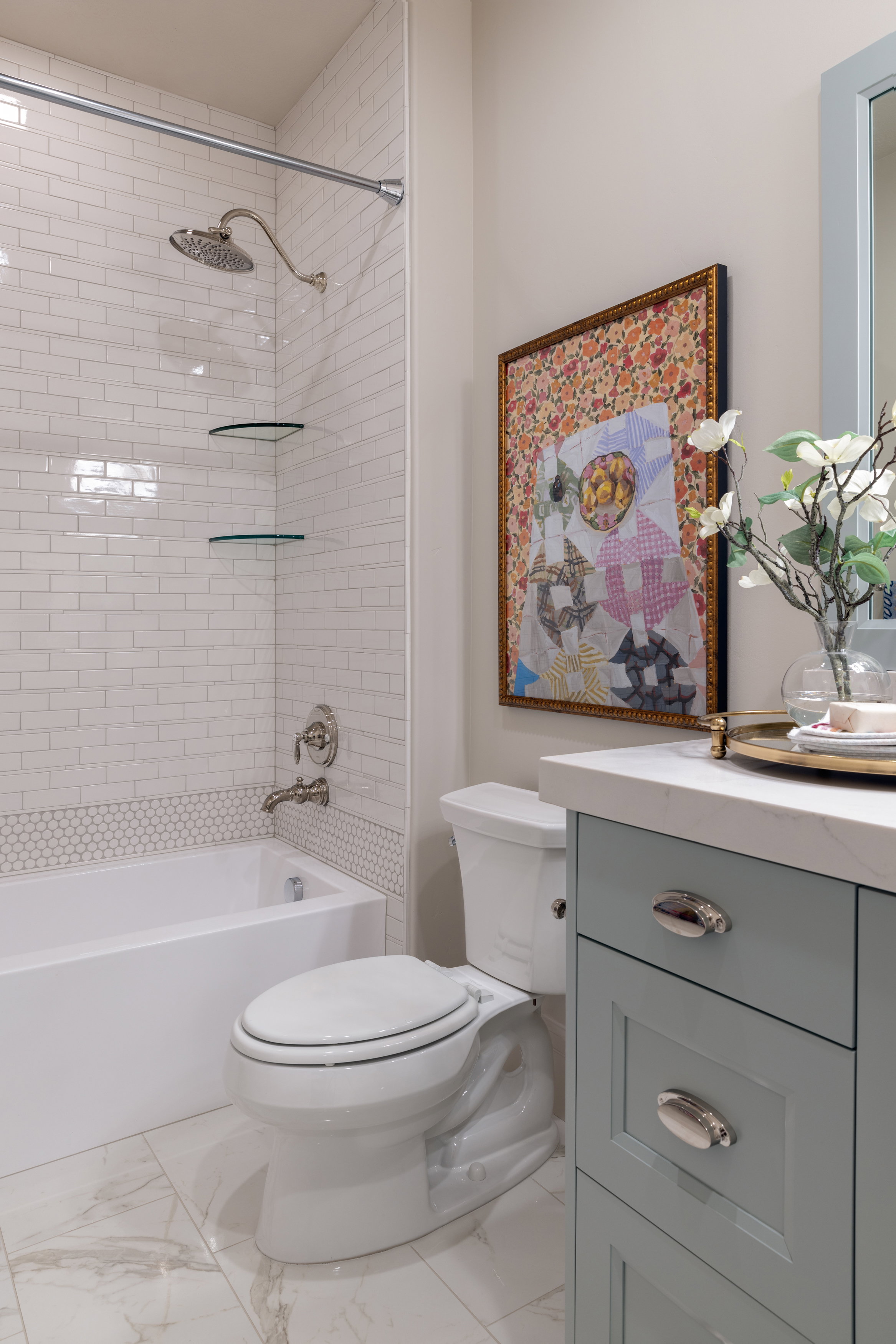 Full bathroom featuring vanity, shower / tub combination, and light marble finish flooring