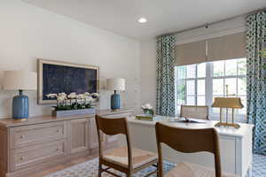 Dining space with a desk, recessed lighting, and light wood finished floors