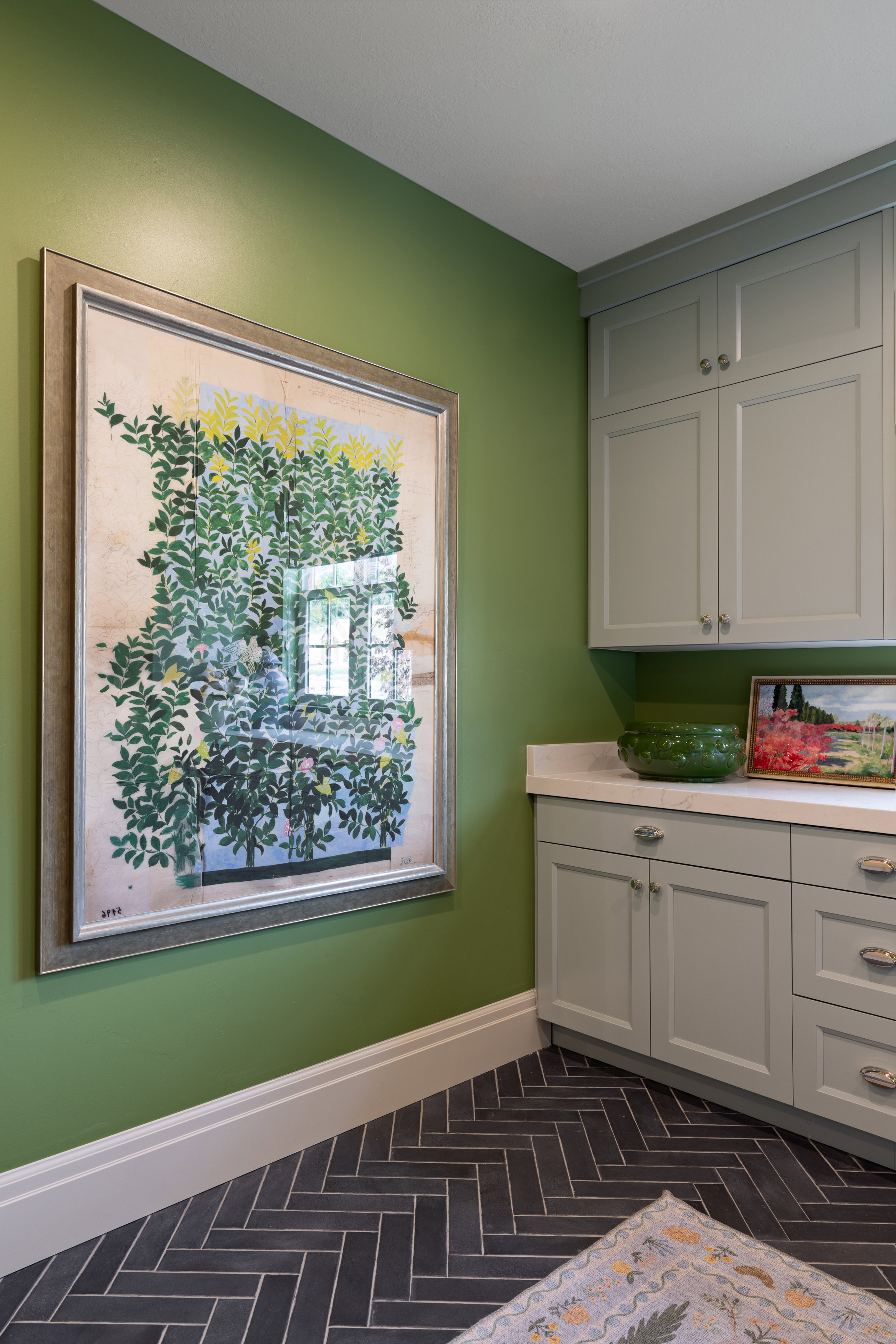 Kitchen featuring baseboards and white cabinetry