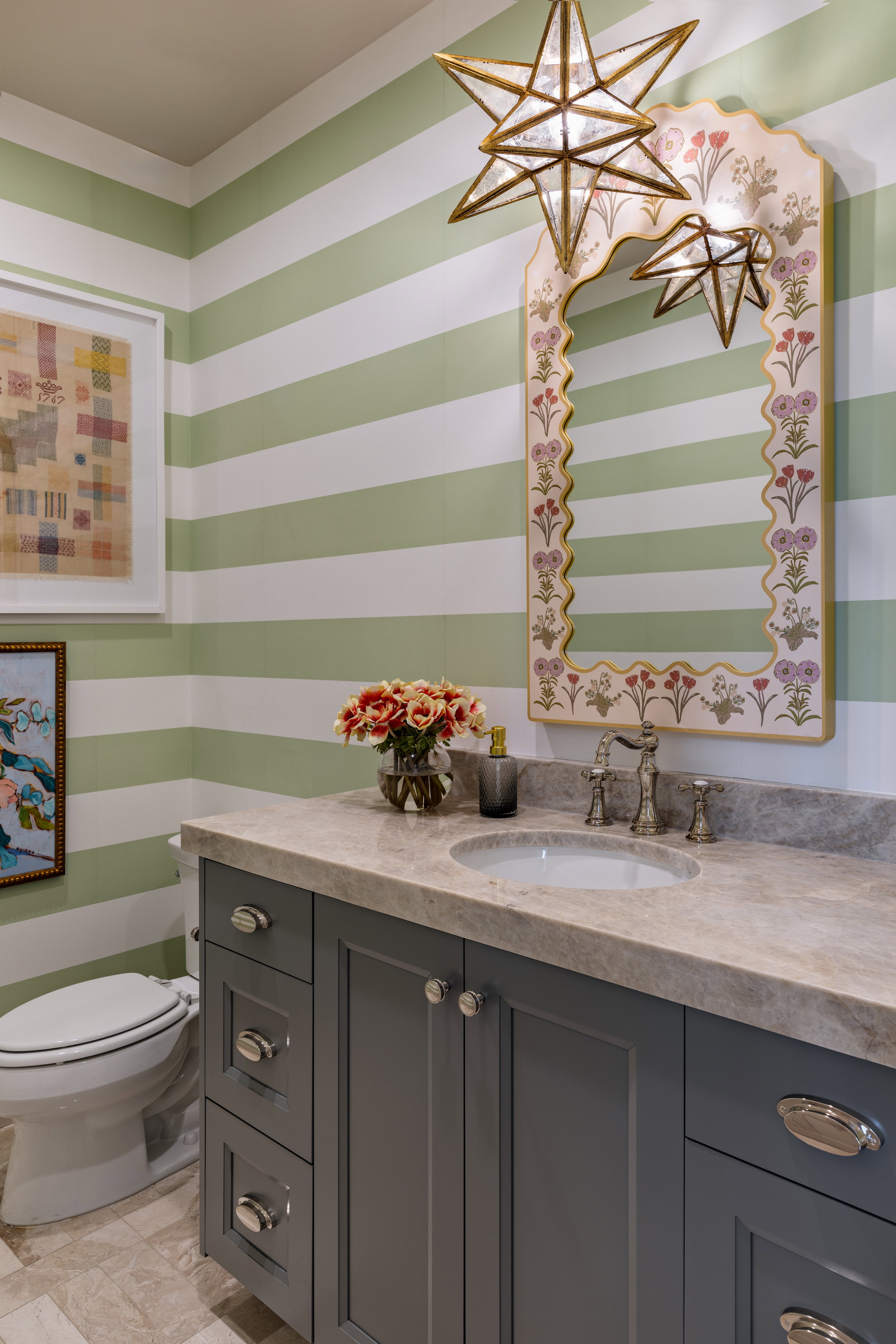 Half bath featuring vanity and wallpapered walls