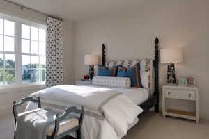 Carpeted bedroom with baseboards