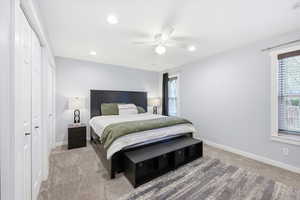 Bedroom with carpet flooring, a closet, ceiling fan, and recessed lighting