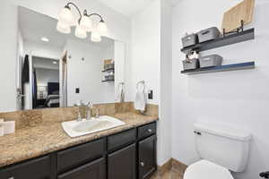 Ensuite bathroom with vanity and toilet