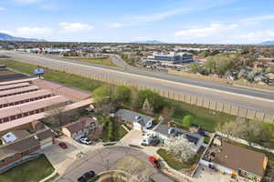 Aerial view of residential area featuring a mountainous background