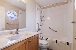 Full bathroom with vanity and shower / tub combination