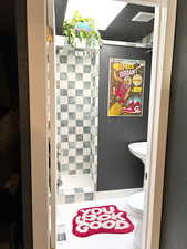 Bathroom with toilet and a shower stall