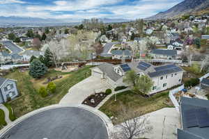 Aerial perspective of suburban area featuring a mountain backdrop