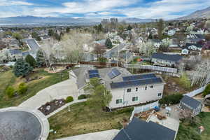 Aerial perspective of suburban area with a mountain backdrop