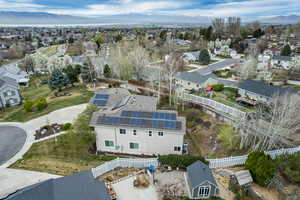 Aerial perspective of suburban area featuring a mountain backdrop