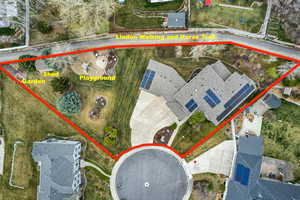 Aerial view of property and surrounding area with property boundaries highlighted