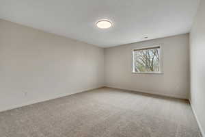4th Bedroom with carpet flooring and baseboards