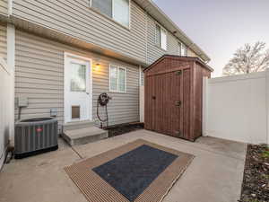 View of patio / terrace with a storage unit and entry steps