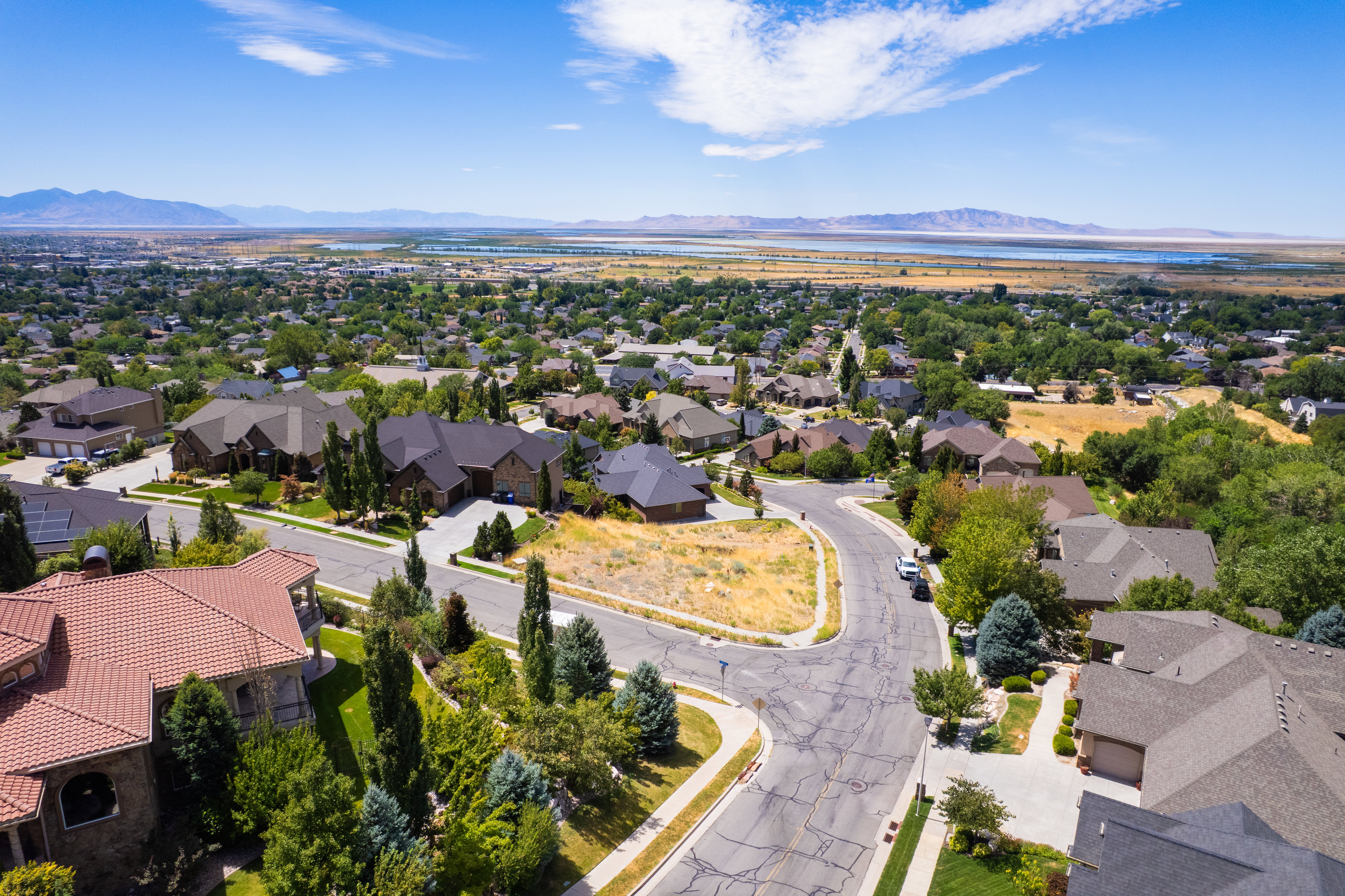 Aerial perspective of suburban area featuring a mountainous background