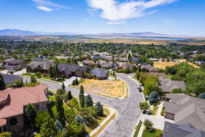 Aerial perspective of suburban area featuring a mountainous background