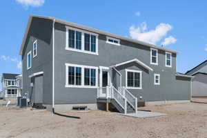Back of property featuring stucco siding