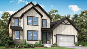 View of front of house with board and batten siding, an attached garage, and driveway