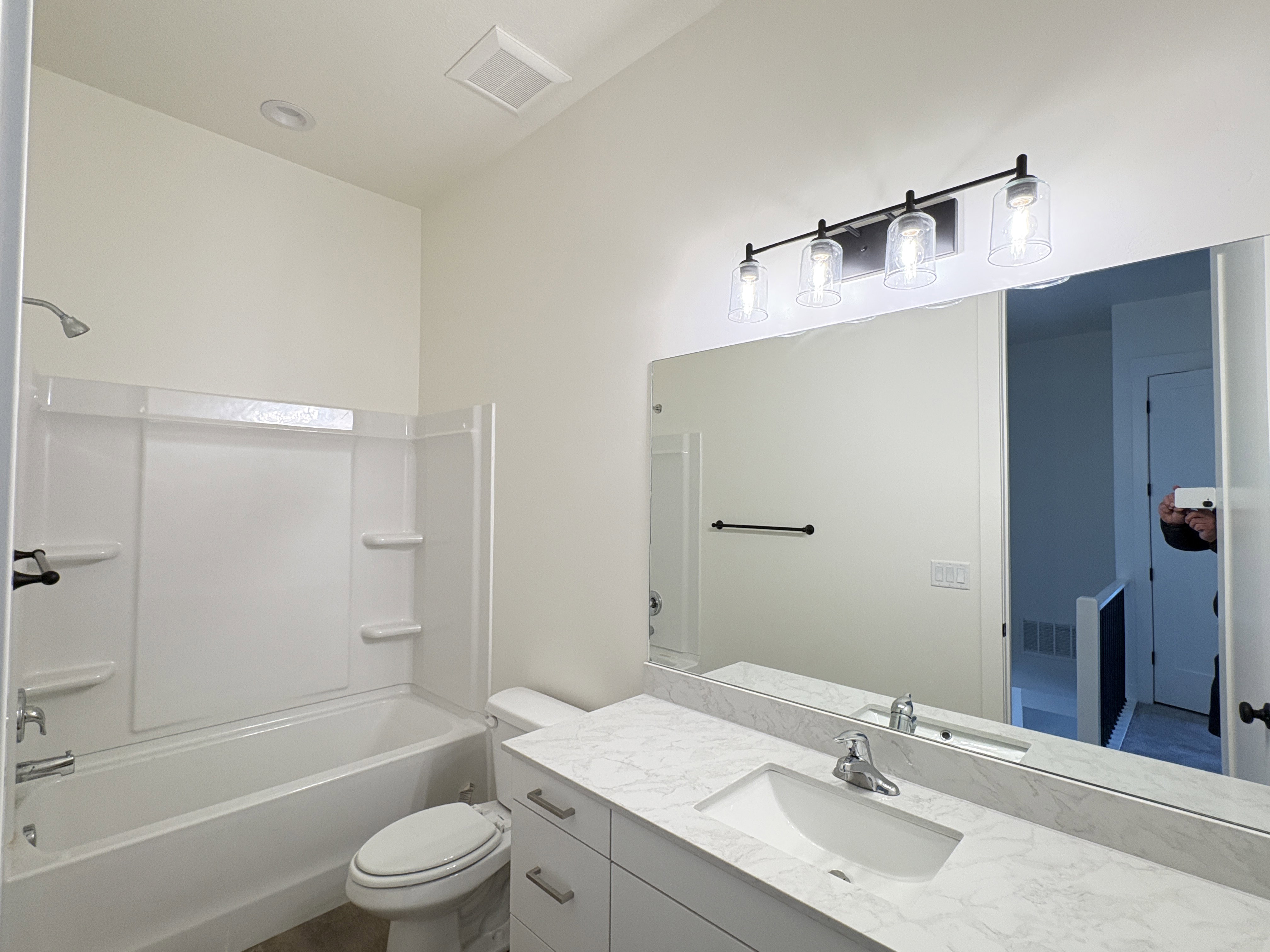 Bathroom with vanity and tub / shower combination