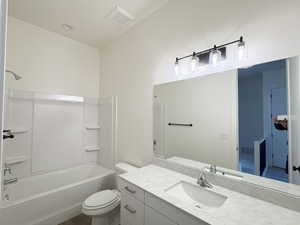 Bathroom with vanity and tub / shower combination
