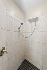 Bathroom featuring a tile shower