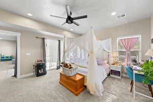 Bedroom with access to exterior, light carpet, ceiling fan, and recessed lighting