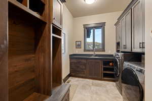 Laundry room with cabinet space and washer and dryer