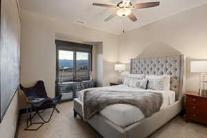 Bedroom featuring a mountain view and a ceiling fan