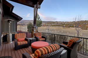 Wooden terrace with a mountain view and outdoor lounge area