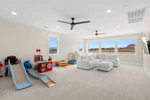 Game room featuring carpet, plenty of natural light, ceiling fan, and recessed lighting