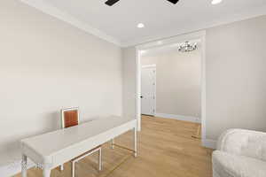Office area featuring ornamental molding, light wood-style flooring, ceiling fan, and recessed lighting