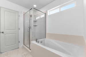 Contemporary bathroom featuring a built-in soaking tub, glass-enclosed shower with tiled walls and built-in shelving, and a high transom window