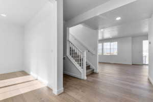 Light wood-finish flooring throughout the main level